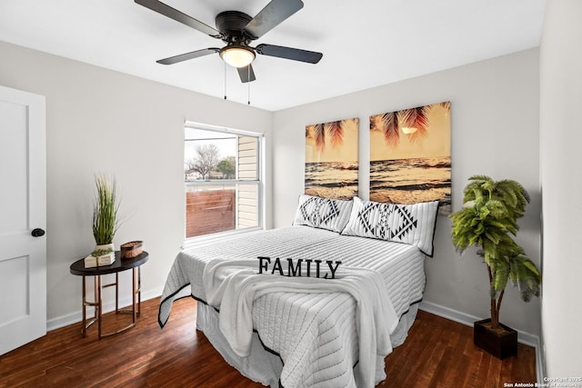 bedroom with ceiling fan, wood finished floors, and baseboards