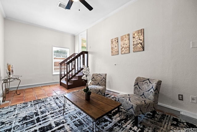 living area with ceiling fan, visible vents, baseboards, stairs, and ornamental molding