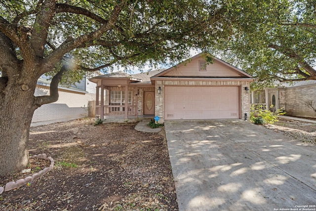 ranch-style house with driveway, a garage, a porch, and brick siding