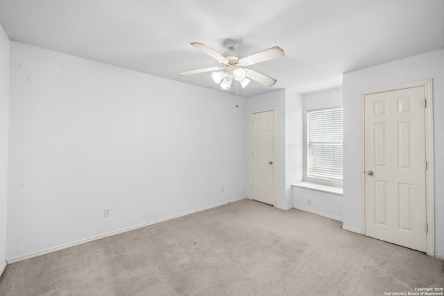 unfurnished bedroom featuring carpet floors, ceiling fan, and baseboards