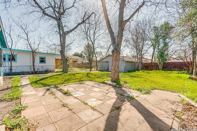 view of patio / terrace featuring fence private yard and an outdoor structure