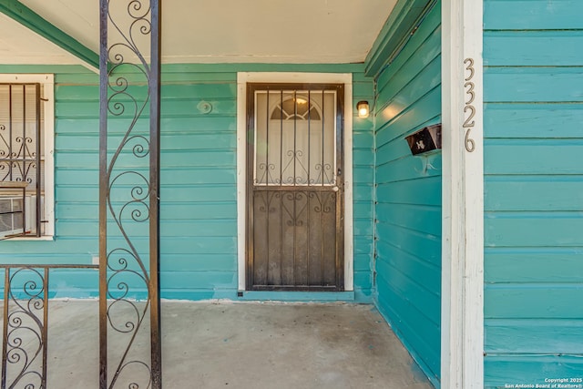 doorway to property featuring a garage