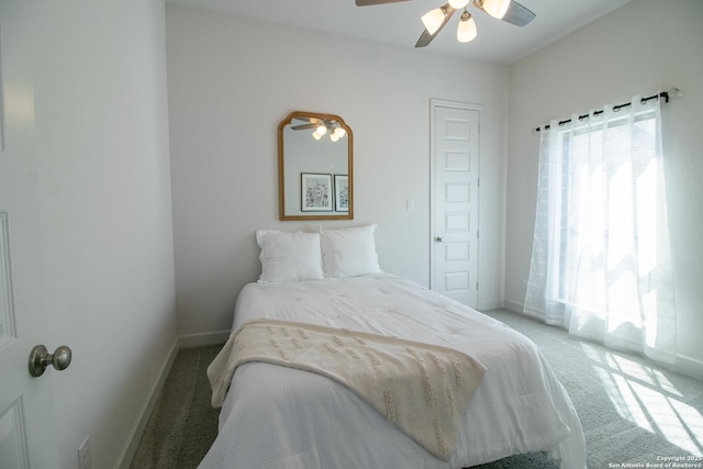 bedroom with carpet, baseboards, and ceiling fan