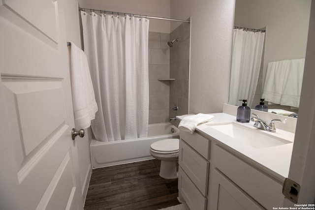 full bathroom with toilet, shower / bathtub combination with curtain, vanity, and wood finished floors