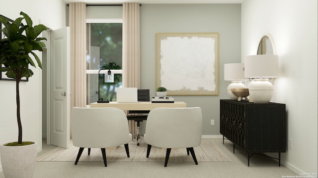 dining space featuring carpet and baseboards