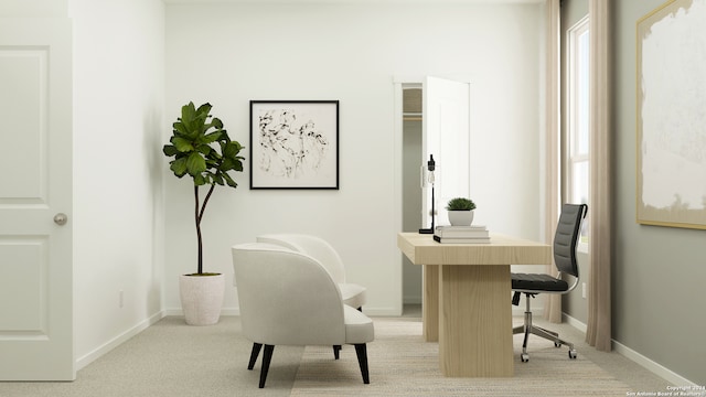 office area with a wealth of natural light, light carpet, and baseboards