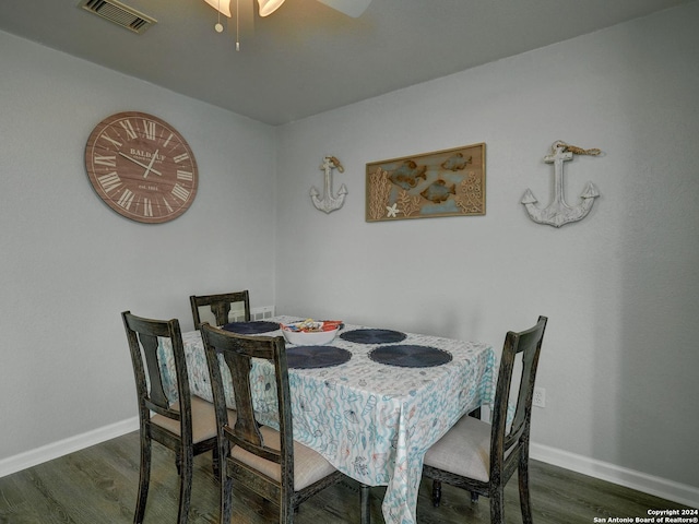 dining room with visible vents, baseboards, and wood finished floors