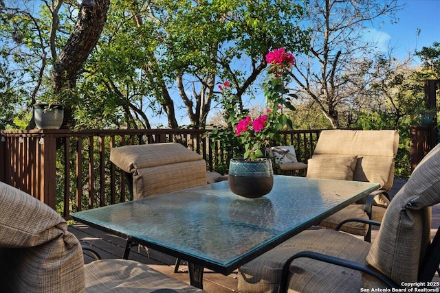 deck featuring outdoor dining area