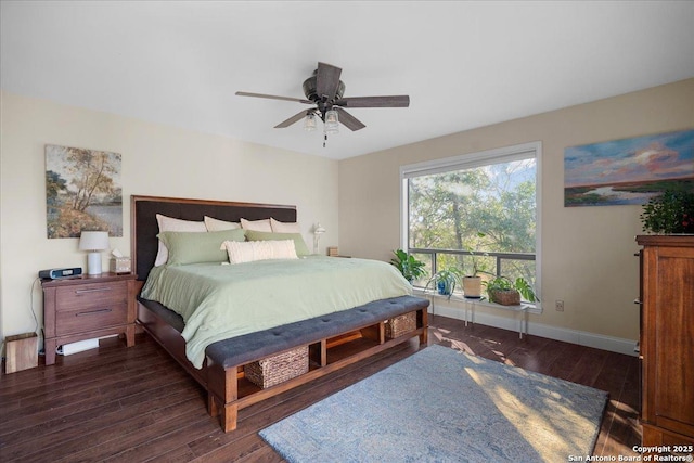 bedroom featuring a ceiling fan, baseboards, and dark wood-style flooring