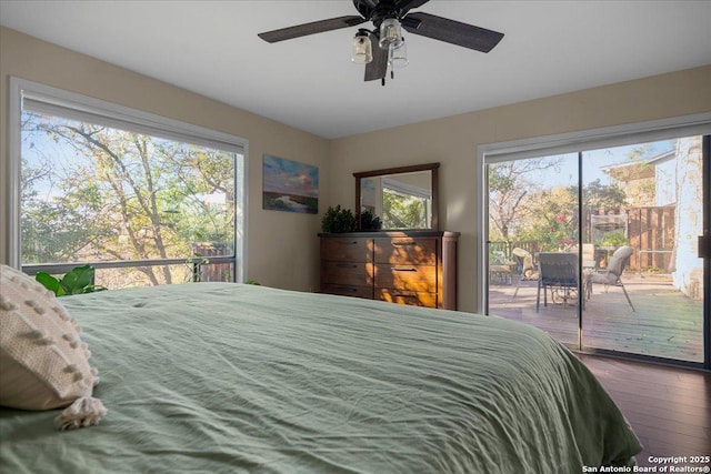 bedroom with access to outside, multiple windows, wood-type flooring, and a ceiling fan