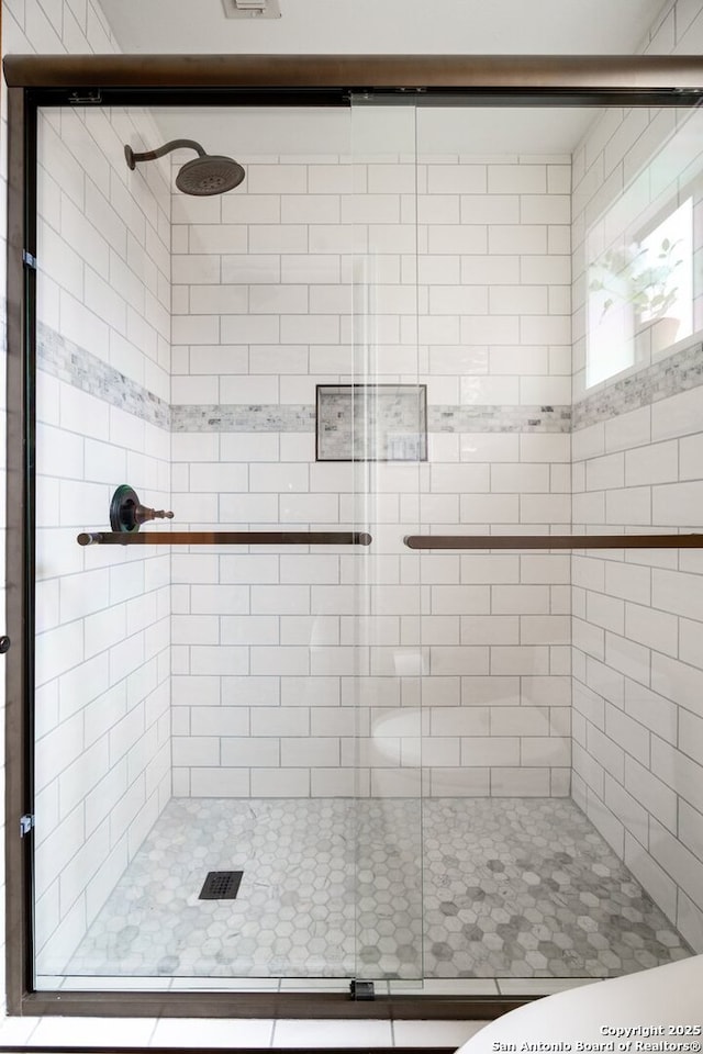 bathroom featuring a stall shower