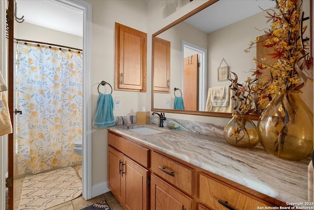 full bath with curtained shower, vanity, toilet, and tile patterned floors