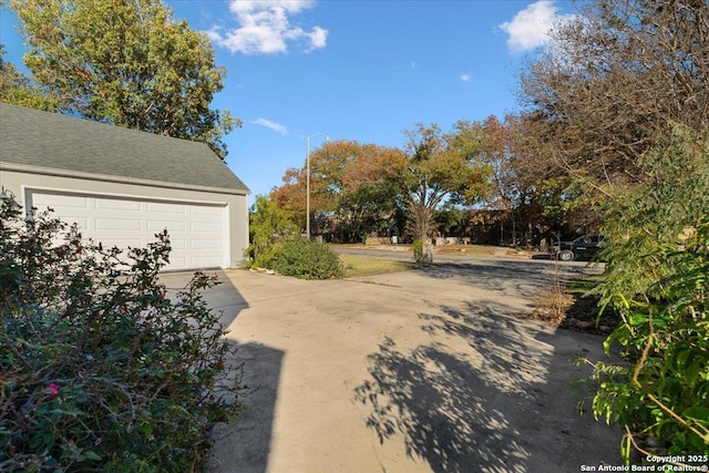 view of yard featuring a garage