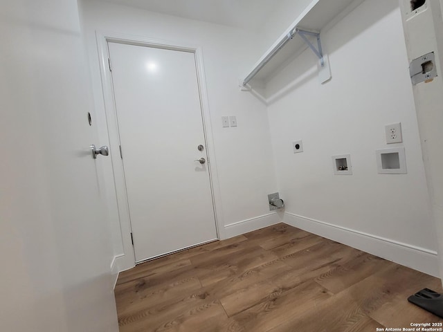 clothes washing area with laundry area, baseboards, wood finished floors, hookup for an electric dryer, and washer hookup