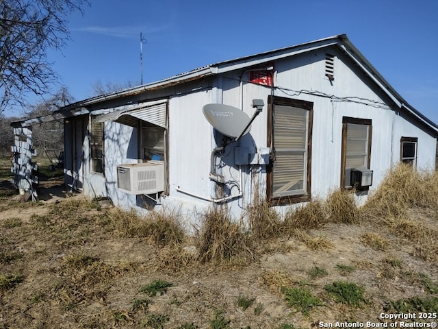 view of side of property featuring cooling unit