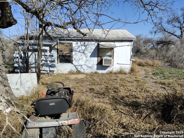 view of side of home with cooling unit