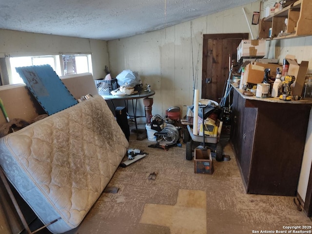 interior space featuring a textured ceiling