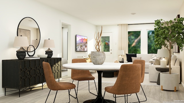 dining space featuring light wood finished floors