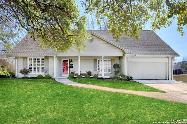 view of front of home featuring a porch, an attached garage, a shingled roof, driveway, and a front yard