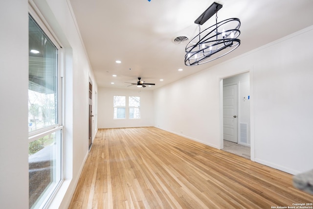 unfurnished room with baseboards, recessed lighting, visible vents, and light wood-style floors