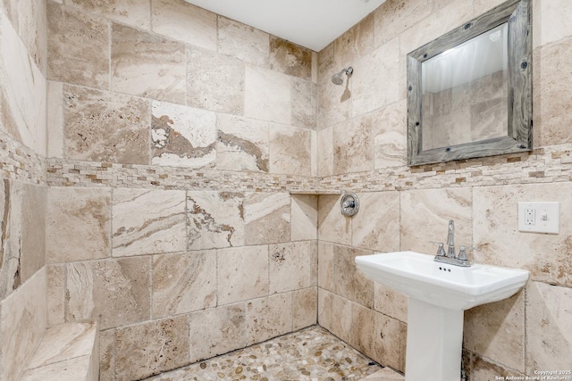 full bath with a tile shower