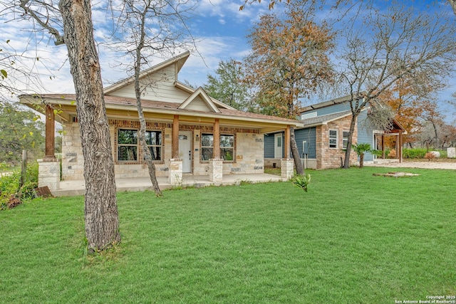 view of front of property with stone siding and a front lawn