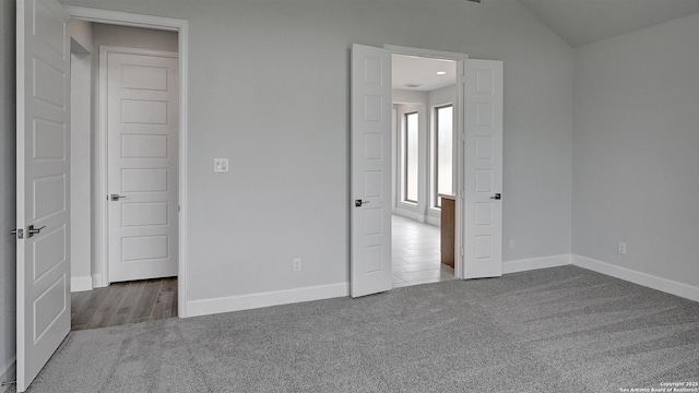 417 Verdad Way, Boerne, TX 78006 - unfurnished bedroom with carpet floors, baseboards, and vaulted ceiling