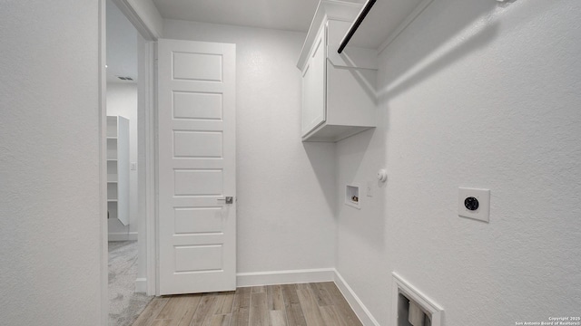417 Verdad Way, Boerne, TX 78006 - washroom featuring cabinet space, light wood-type flooring, washer hookup, electric dryer hookup, and baseboards