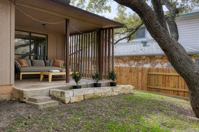 view of patio featuring fence