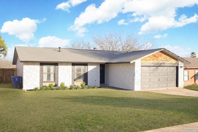 view of front facade with concrete driveway, stone siding, an attached garage, fence, and a front yard