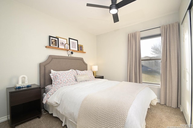 carpeted bedroom with a ceiling fan