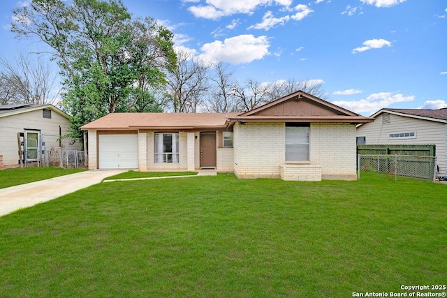 ranch-style house featuring a garage, driveway, and a front lawn