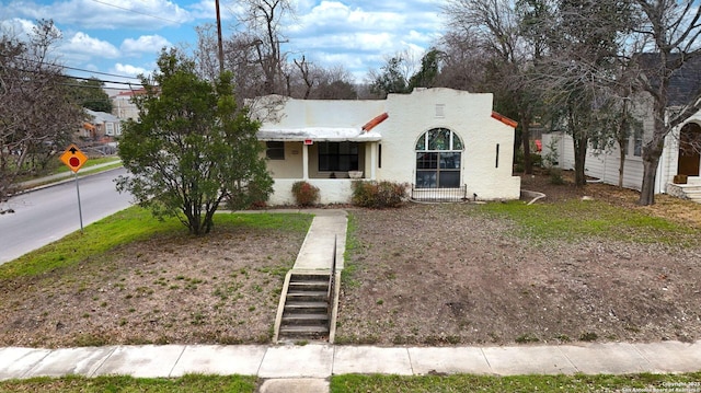 view of front of property featuring stucco siding