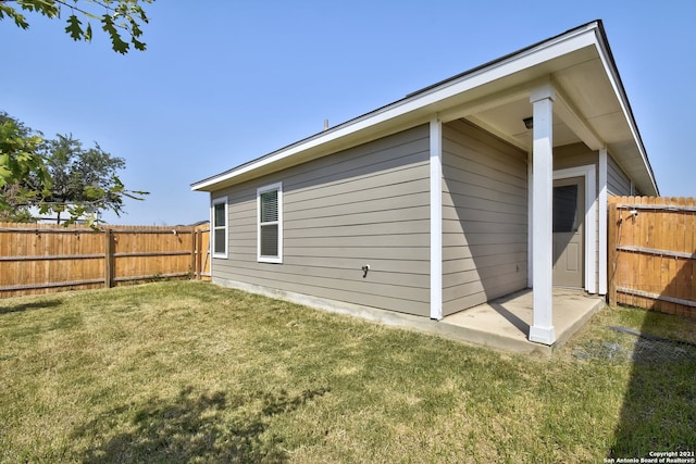 exterior space with a yard and a fenced backyard