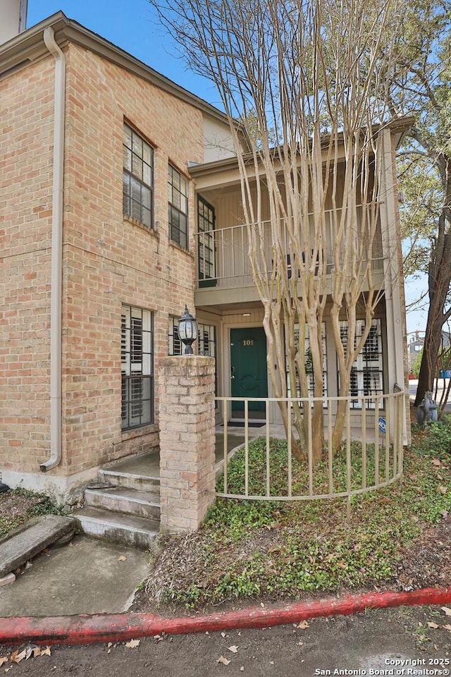 view of property with fence