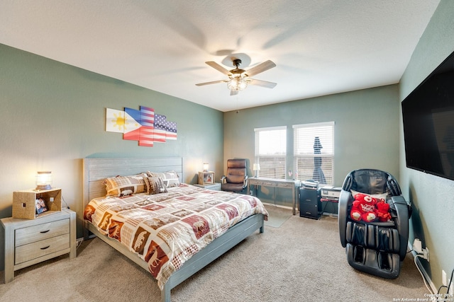 bedroom with ceiling fan and light colored carpet