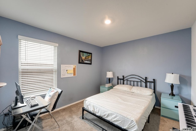 carpeted bedroom with baseboards