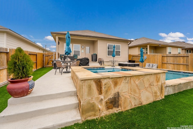 exterior space with outdoor dining area, a fenced backyard, a fenced in pool, and a hot tub