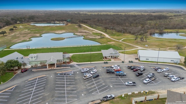 bird's eye view with view of golf course and a water view