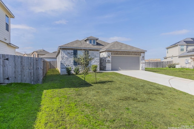 view of front of home featuring concrete driveway, stone siding, an attached garage, fence, and a front yard