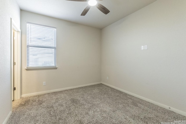 empty room featuring a ceiling fan, carpet, and baseboards