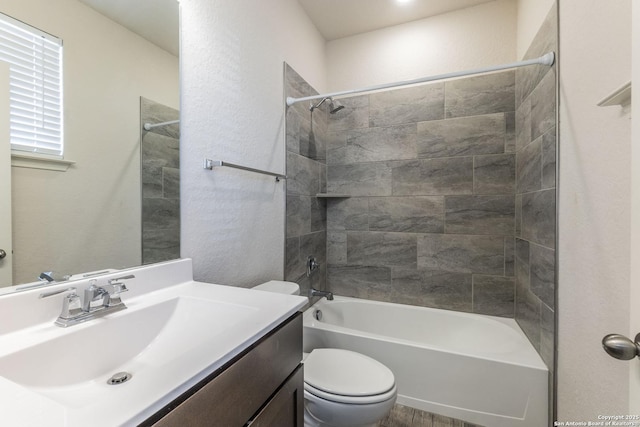 full bathroom with bathtub / shower combination, vanity, and toilet