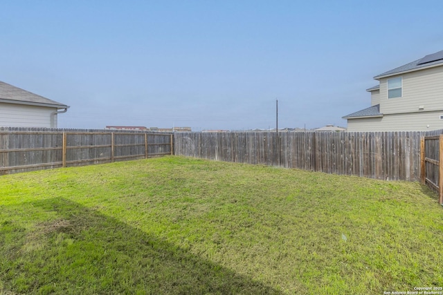 view of yard featuring a fenced backyard