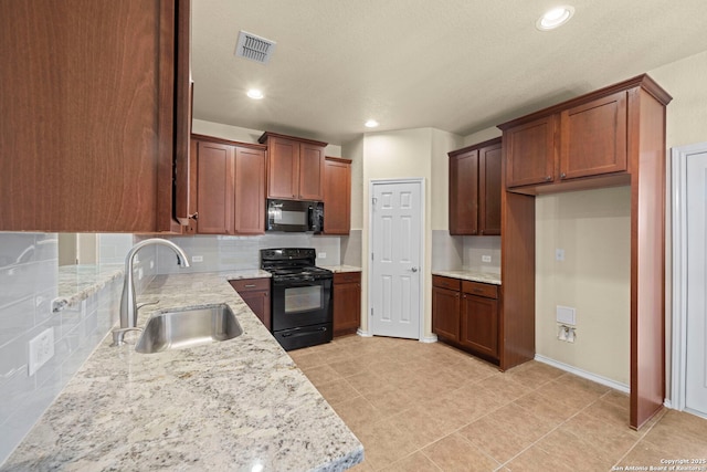 kitchen with visible vents, decorative backsplash, black appliances, a sink, and recessed lighting