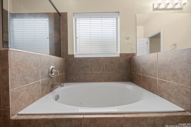 full bathroom with a garden tub