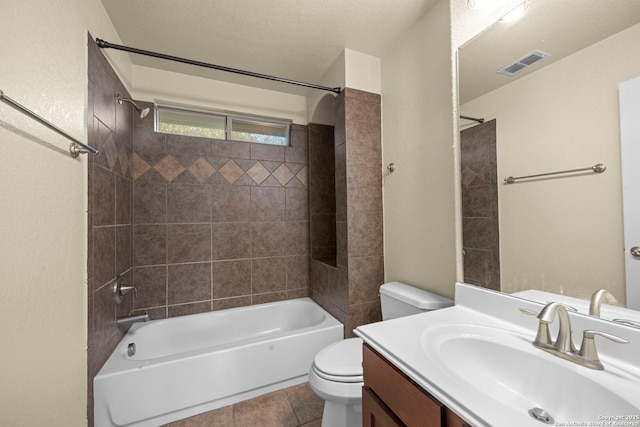 full bath with visible vents, toilet, a textured ceiling, vanity, and shower / bathing tub combination