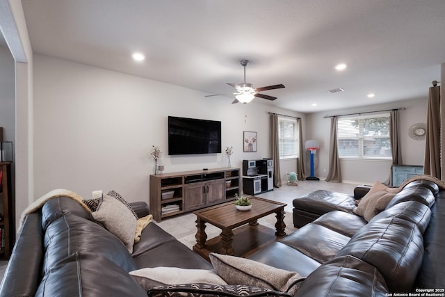 living room with a ceiling fan, visible vents, and recessed lighting