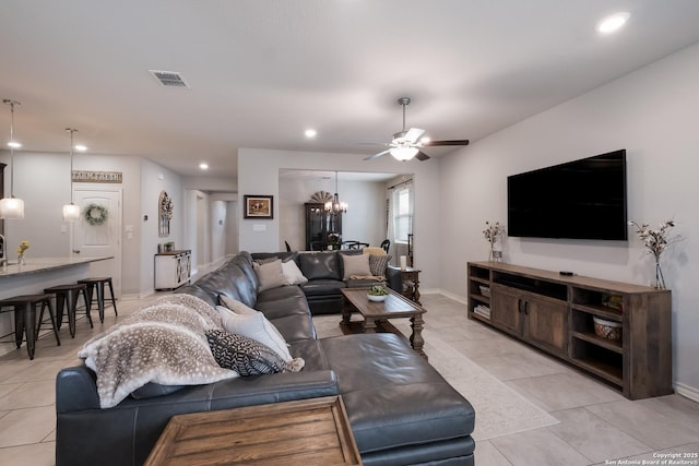 living room with ceiling fan with notable chandelier, light tile patterned floors, visible vents, and recessed lighting