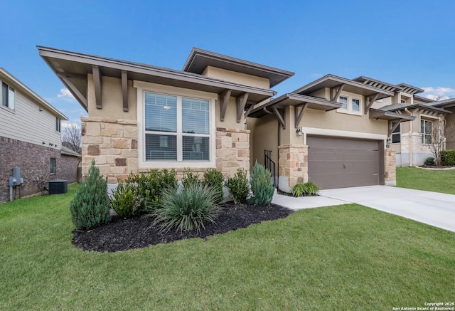 prairie-style house with stone siding, a front yard, concrete driveway, and stucco siding