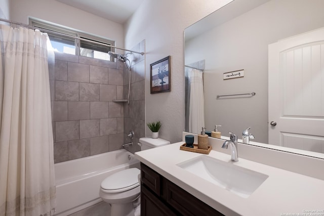 full bathroom featuring toilet, shower / bathtub combination with curtain, and vanity